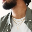 Male Model Wearing Irregular Pearl Initial Necklace in Gold with Other Necklaces