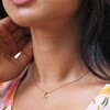 Close Up of Model Wearing Gold Crescent Moon Necklace