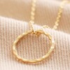 Hammered Halo Pendant Necklace in Gold on Neutral Fabric
