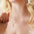 Model Wearing E Irregular Pearl Initial Necklace in Gold