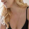 Blonde Model Wearing Large 3D Molten Heart Pendant Necklace in Gold