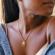 Close Up of Model Wearing Lion Door Knocker Pendant Necklace in Gold