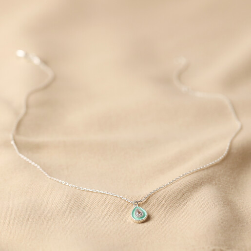 Full Length of Mint Green Crystal Enamel Necklace in Silver on Fabric