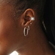 Close Up of Textured Hoop Earrings in Silver Styled with Other Earrings
