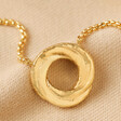 Organic Molten Russian Ring Pendant Necklace in Gold on Neutral Fabric