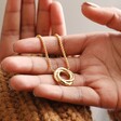 Model Holding Organic Molten Russian Ring Pendant Necklace in Gold