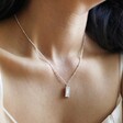 Model Wearing Personalised Birth Flower Tiny Tag Pendant Necklace in Silver