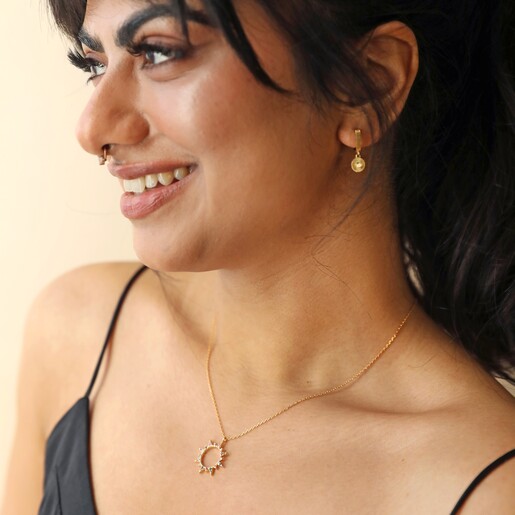 Rainbow Crystal Sunburst Pendant Necklace in Gold on Model