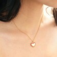 Model Wearing Red Enamel Heart Pendant Necklace in Gold Close Up