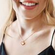 Model Wearing Red Enamel Heart Pendant Necklace in Gold