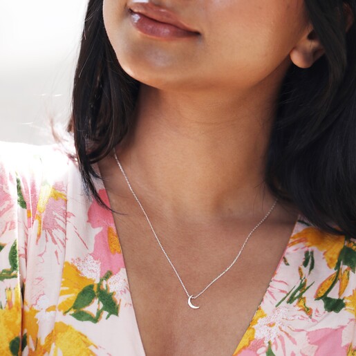 Close Up of Silver Crescent Moon Necklace on Model