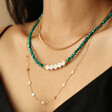 Woven Chain Necklace in Gold Layered on Model with Green and Gold Necklaces