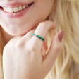 Smiling Model Wearing Green Enamel Crystal Ring in Gold
