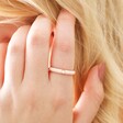 Model Wearing Pink Enamel Crystal Ring in Gold with Hand in Hair