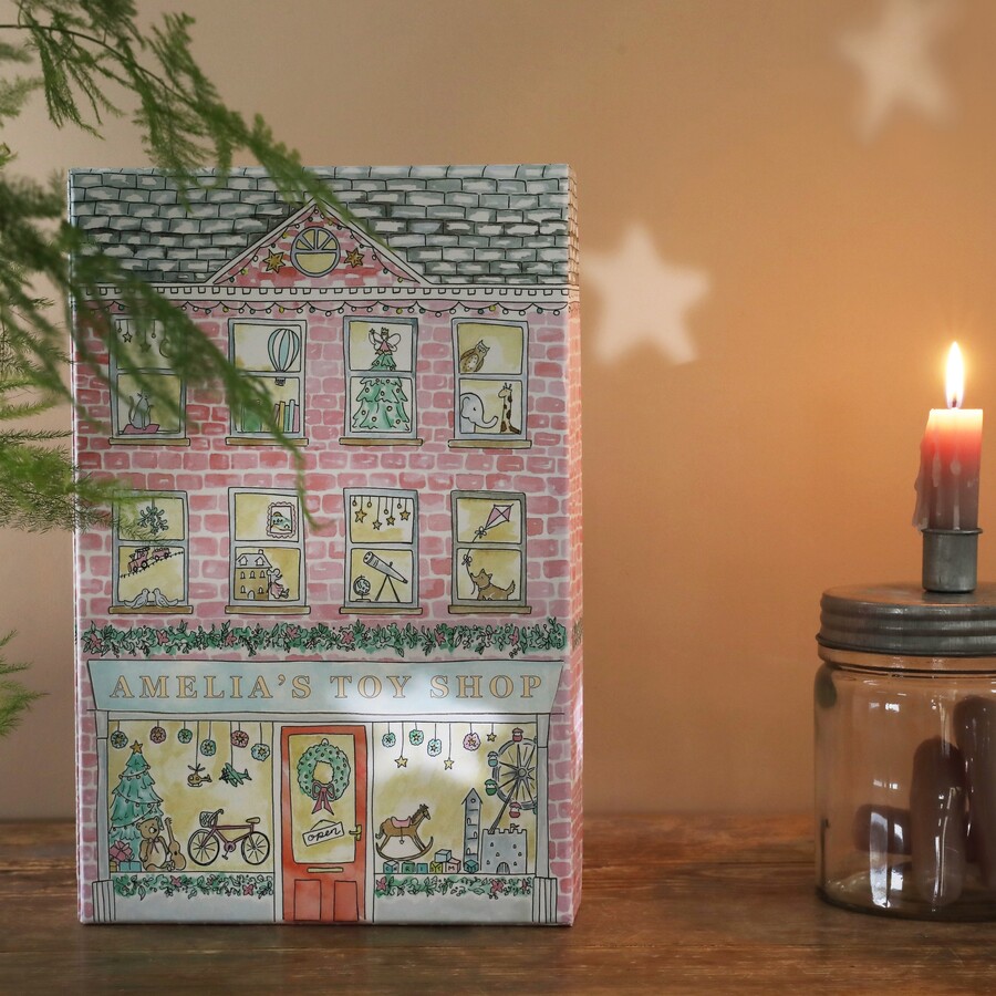 Cardboard Personalised Fill Your Own Toy Shop Advent Calendar Next to Lit Candle