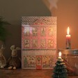 Personalised Fill Your Own Toy Shop Advent Calendar with Lit Candles on Table