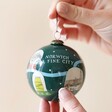 Model Holding the Hand-Painted Norwich Snow Globe Bauble