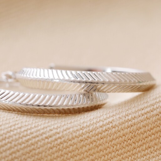 Herringbone Edge Hoop Earrings in Silver on Cream Fabric