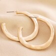 Organic Hammered Hoop Earrings in Gold on Beige Coloured Fabric