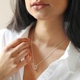 Organic Hoops Pendant Necklace in Silver Being Worn by Model with Natural Background