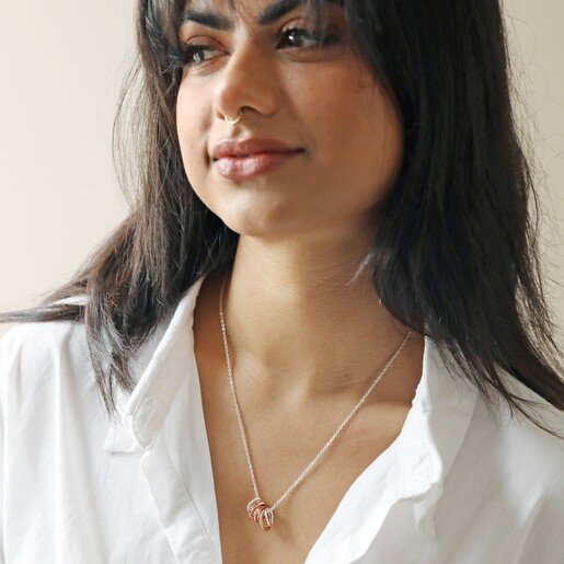 Model Wearing Organic Hoops Pendant Necklace in Silver with Neutral Backdrop