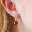 Close Up of Model Wearing Red Agate Stone Bead Drop Earrings