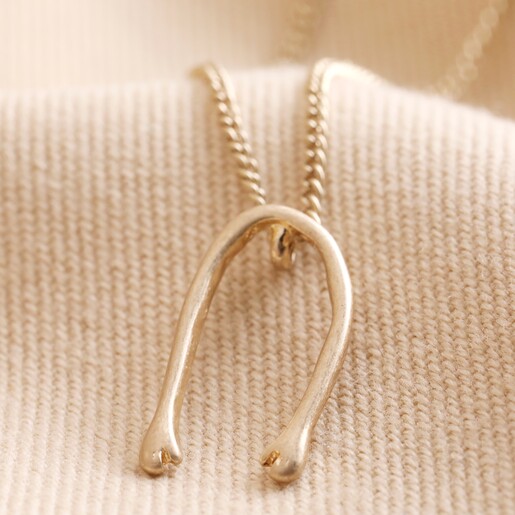 Slim Hug Hands Pendant Necklace in Gold Close Up Showing Pendant