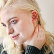 Blonde Model Wearing Textured Hoop Ear Cuff in Gold