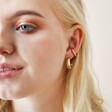 Model Wearing Textured Hoop Ear Cuff in Gold with Other Earrings