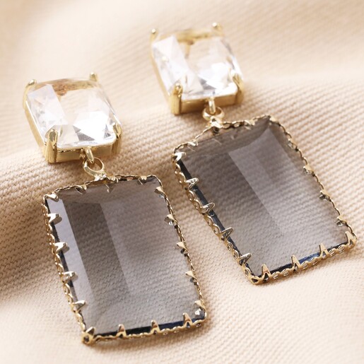 Big Metal London Cosette Gemstone Drop Earrings in Blue on Beige Coloured Fabric