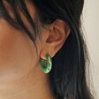 Model Wearing Big Metal London Engraved Edge Green Enamel Hoop Earrings in Gold 