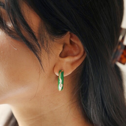 Close Up of Model Wearing Big Metal London Engraved Edge Green Enamel Hoop Earrings in Gold