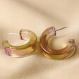Big Metal London Iridescent Resin Hoop Earrings in Pink on Neutral Fabric