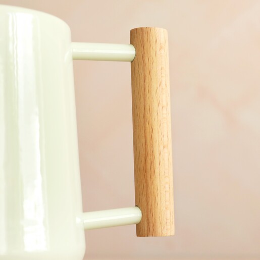Close Up of Beech Handle on Burgon & Ball Pale Jade Indoor Watering Can
