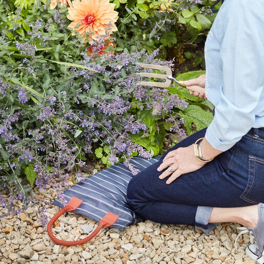 Model Using Burgon & Ball RHS Gardening Hand Fork in Garden