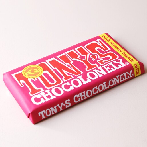 Tony's Chocolonely Milk Caramel Biscuit Chocolate Bar on Neutral Background