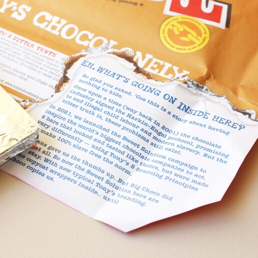Tony's Chocolonely Milk Caramel Biscuit Chocolate Bar Inside of Packaging 