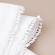 Close Up of Bobble Trim Detailing on Personalised Message and Initials Embroidered White Linen Napkin