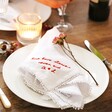 Personalised Message and Initials Embroidered White Linen Napkin on Dinner Table