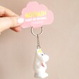 House of Disaster Moomin Snorkmaiden Keyring Held by Model Against Neutral Wall