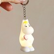 House of Disaster Moomin Snorkmaiden Keyring Lit Up Against Neutral Wall