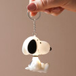 Lit Up House of Disaster Peanuts Snoopy Light-Up Keyring Held By Model