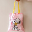 Model Holding House of Disaster Recycled Peanuts Snoopy Shopper Tote in Front of Natural Coloured Background