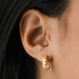 Estella Bartlett Cosmic Chunky Hoops in Gold on Model Close Up