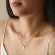 Model Wearing Estella Bartlett Crystal Rainbow Pendant Necklace in Gold