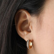 Model Wearing Estella Bartlett Cubic Zirconia Enamel Hoop Earrings in Gold