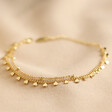 Estella Bartlett Layered Heart and Ball Chain Bracelet in Gold on Natural Coloured Fabric