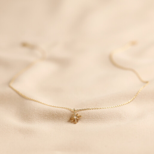 Simple gold star on sale necklace