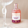 100ml Edmunds Cocktails Chambord Bramble Next to Glass on Beige Background