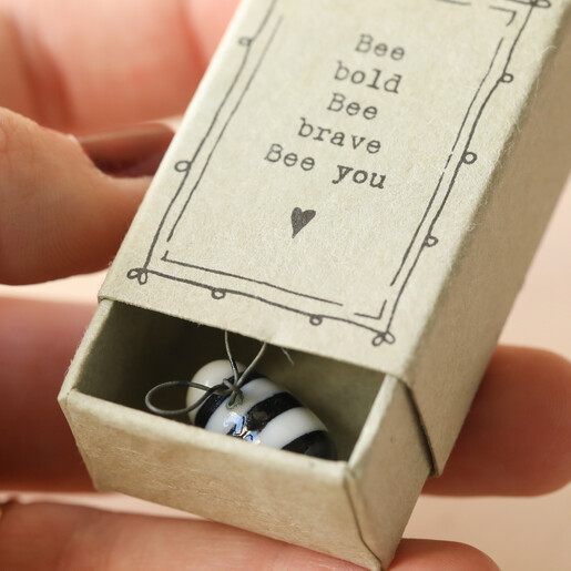 Model Holding Matchbox from East of India Bee Bold Matchbox OrnamentOpen with Bee Inside